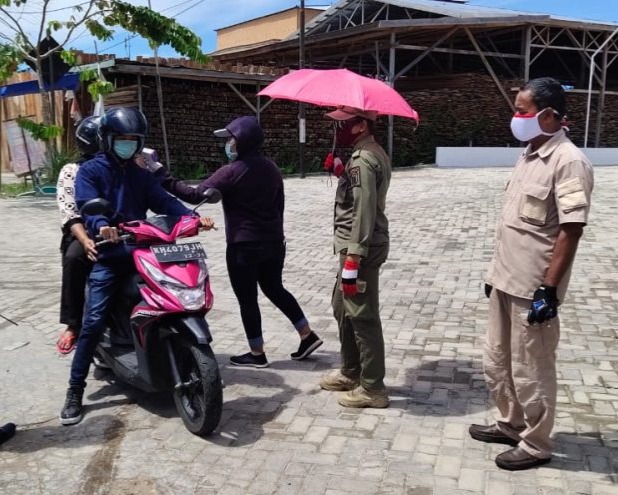 Pelaksanaan PSKH di Kota Palangka Raya, Personil Satuan Brimob Polda Kalteng Ikut Serta Dalam Melaksanakan Kegiatan Penjagaan Pos